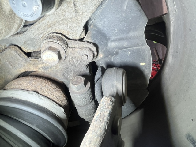 Close-up of suspension and control arm components